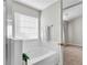 Bathroom featuring a soaking tub, shower, and natural light at 303 Fox Overlook, Woodstock, GA 30188