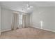 Spacious bedroom features vaulted ceiling, neutral walls, carpet flooring and natural light at 303 Fox Overlook, Woodstock, GA 30188