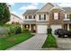 A well maintained townhome with a charming front yard, attached garage, and inviting facade at 303 Fox Overlook, Woodstock, GA 30188