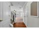 Spacious hallway featuring hardwood floors, stairs, and a view into the living room at 303 Fox Overlook, Woodstock, GA 30188