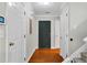 Welcoming foyer featuring hardwood floors, multiple closets, and access to the staircase at 303 Fox Overlook, Woodstock, GA 30188