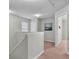 Upstairs hallway with carpeted floor and neutral wall color at 303 Fox Overlook, Woodstock, GA 30188