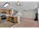 View from kitchen shows open floor plan to the living room with fireplace at 303 Fox Overlook, Woodstock, GA 30188