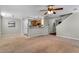 Spacious living room showing kitchen and staircase at 303 Fox Overlook, Woodstock, GA 30188