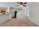 Bright living area shows stairs and kitchen at 303 Fox Overlook, Woodstock, GA 30188