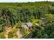 Aerial view of a home surrounded by lush greenery and mature trees at 278 Shire Way, Lawrenceville, GA 30044