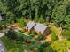 Aerial view featuring landscaped yard, patio and mature trees at 278 Shire Way, Lawrenceville, GA 30044