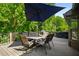 Spacious wooden back deck area with seating, an umbrella, a grill and lots of trees at 278 Shire Way, Lawrenceville, GA 30044