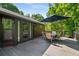 Spacious back deck with outdoor seating and views of a lush, wooded backyard at 278 Shire Way, Lawrenceville, GA 30044