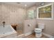 Modern bathroom showcasing a bathtub, shower, and toilet at 278 Shire Way, Lawrenceville, GA 30044