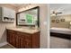Bathroom with granite counters, double sinks, and view to bedroom at 278 Shire Way, Lawrenceville, GA 30044