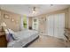 Bedroom with a ceiling fan, closet, and cozy decor at 278 Shire Way, Lawrenceville, GA 30044