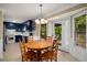 Cozy dining area with access to an outdoor patio and a view into the kitchen at 278 Shire Way, Lawrenceville, GA 30044