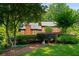 Beautiful two-story home surrounded by mature trees and manicured landscaping at 278 Shire Way, Lawrenceville, GA 30044