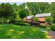 Well-maintained lawn and mature trees surround this two-story home at 278 Shire Way, Lawrenceville, GA 30044