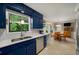 Modern kitchen featuring white countertops, stainless steel appliances, and blue cabinets at 278 Shire Way, Lawrenceville, GA 30044
