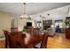Open-concept living room with vaulted ceilings, fireplace, and a view into the dining area at 278 Shire Way, Lawrenceville, GA 30044