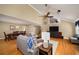Bright living room opens to the dining area with hardwood floors and vaulted ceilings at 278 Shire Way, Lawrenceville, GA 30044