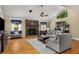 Bright living room features a vaulted ceiling, stone fireplace, and hardwood floors at 278 Shire Way, Lawrenceville, GA 30044