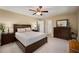 Bright bedroom with a view of the backyard, ceiling fan, and neutral wall color at 278 Shire Way, Lawrenceville, GA 30044
