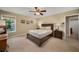 Comfortable bedroom with neutral colors, ceiling fan, and ample natural light at 278 Shire Way, Lawrenceville, GA 30044