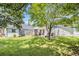 Spacious backyard featuring a private patio with outdoor dining and seating area at 3198 Liberty Commons Dr, Kennesaw, GA 30144