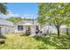 Lush backyard with patio featuring seating and a grilling area for entertaining at 3198 Liberty Commons Dr, Kennesaw, GA 30144
