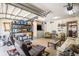 Finished garage boasts seating, shelving, television, and comfortable living space at 3198 Liberty Commons Dr, Kennesaw, GA 30144