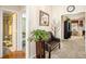 Hallway featuring cozy chair and entrances to the living room and bathroom at 3198 Liberty Commons Dr, Kennesaw, GA 30144