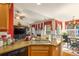 Spacious kitchen flows into the dining area, featuring sleek appliances and stone counters, perfect for modern living and entertaining at 3198 Liberty Commons Dr, Kennesaw, GA 30144