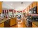 Open kitchen with wooden cabinets, modern appliances, and connection to a dining area at 3198 Liberty Commons Dr, Kennesaw, GA 30144