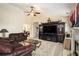 Bright living room boasts plush carpet, a decorative fireplace, media center, and comfortable seating for relaxation and entertaining at 3198 Liberty Commons Dr, Kennesaw, GA 30144