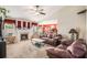 Inviting living room with cozy fireplace, neutral carpet, and bright windows at 3198 Liberty Commons Dr, Kennesaw, GA 30144