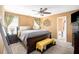 Spacious main bedroom featuring a ceiling fan and ensuite bathroom at 3198 Liberty Commons Dr, Kennesaw, GA 30144