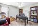 Bright office with large window and functional desk and bookcase at 3198 Liberty Commons Dr, Kennesaw, GA 30144