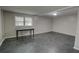 Finished basement with dark floors and natural light at 4852 Pine Shadows Dr, Stone Mountain, GA 30088