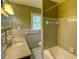 The bathroom featuring gray tiling, a vanity with granite top, and a bathtub at 4852 Pine Shadows Dr, Stone Mountain, GA 30088