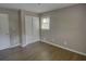 Bedroom featuring hardwood floors, and closet with a window view at 4852 Pine Shadows Dr, Stone Mountain, GA 30088
