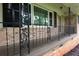 Close up of the front porch with ornate iron railings and brick facade at 4852 Pine Shadows Dr, Stone Mountain, GA 30088