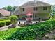Beautiful backyard featuring a patio with a red umbrella at 750 Whitehall Way, Roswell, GA 30076