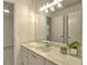 Bathroom featuring marble countertops, vanity with a view of the outdoor at 750 Whitehall Way, Roswell, GA 30076