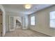 Light-filled bedroom with windows and carpet flooring for a cozy atmosphere at 750 Whitehall Way, Roswell, GA 30076