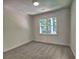 Bright bedroom featuring neutral paint, modern window and plush carpet at 750 Whitehall Way, Roswell, GA 30076