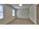 Cozy bedroom with neutral carpet and ample natural light at 750 Whitehall Way, Roswell, GA 30076