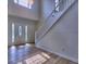 Welcoming entryway featuring a stylish front door, hardwood floors, and staircase at 750 Whitehall Way, Roswell, GA 30076