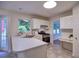Bright kitchen with white cabinets, stainless steel appliances, and a peninsula with sink at 750 Whitehall Way, Roswell, GA 30076