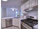 Well-lit kitchen with stainless steel appliances, dishwasher, and modern countertops at 750 Whitehall Way, Roswell, GA 30076