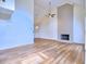 Bright living room boasts hardwood floors, a fireplace, and vaulted ceilings for a cozy atmosphere at 750 Whitehall Way, Roswell, GA 30076