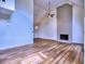 Spacious living room with hardwood floors, high ceilings, brick fireplace, ceiling fan, and large windows at 750 Whitehall Way, Roswell, GA 30076