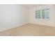 Minimalist bedroom featuring neutral carpet, natural light, and clean design at 799 Birds Se Ml, Marietta, GA 30067